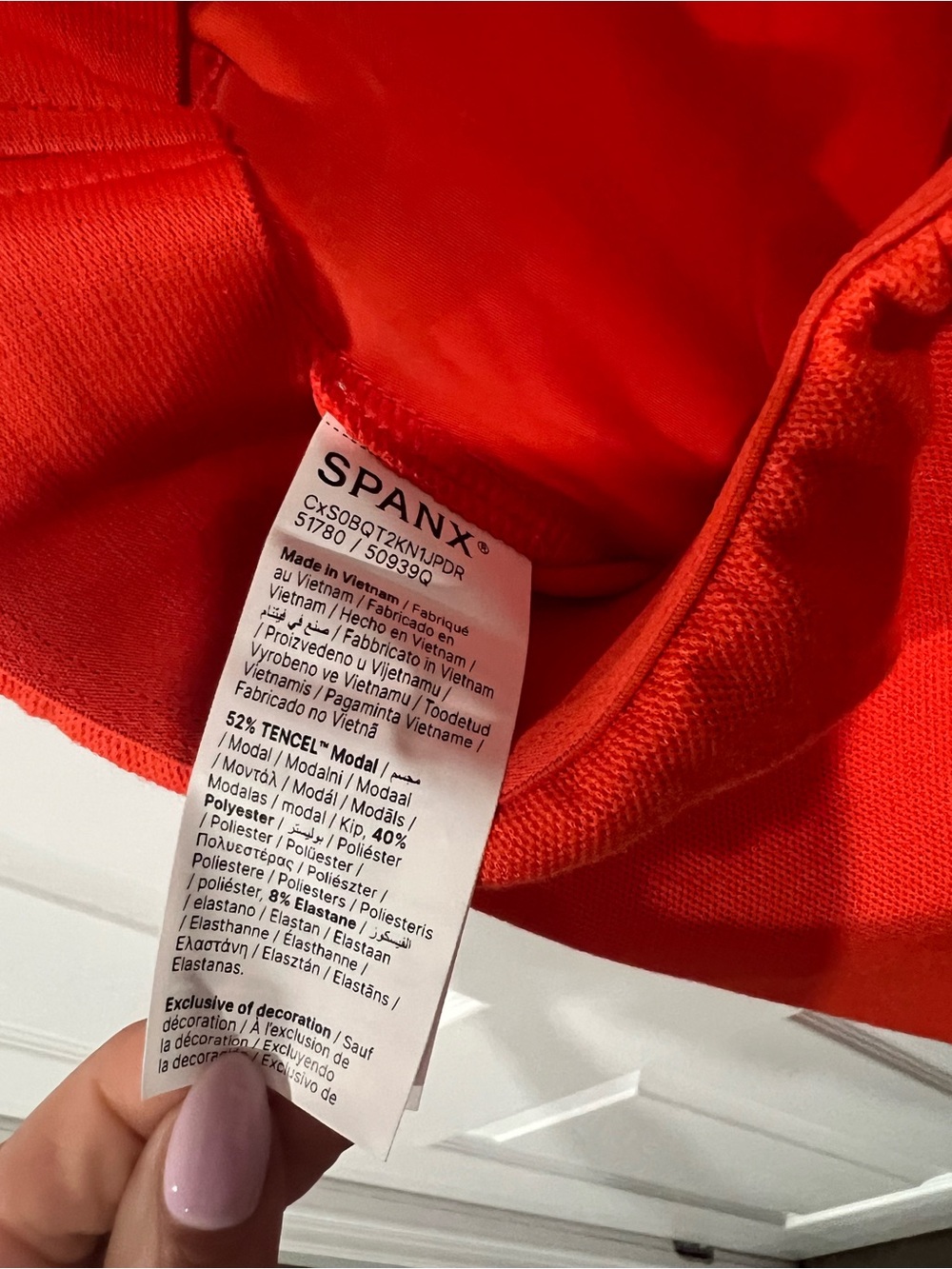 Sleeveless SPANX Air Essentials jumpsuit  in Bright Orange with White Piping - Picture 5 of 6